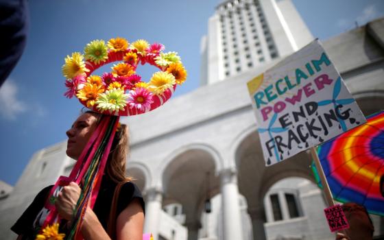 Protesters demonstrate against fracking and neighborhood oil drilling in Los Angeles May 14, 2016. Much of the oil industry's political power lies in the century-old American Petroleum Institute. (CNS photo/Lucy Nicholson, Reuters)