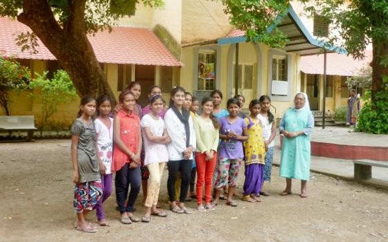 Some of the boarders with their director, Sr. Georgina Jose, in front of Maria Niwas in Nagpur, central India. (Lissy Maruthanakuzhy)