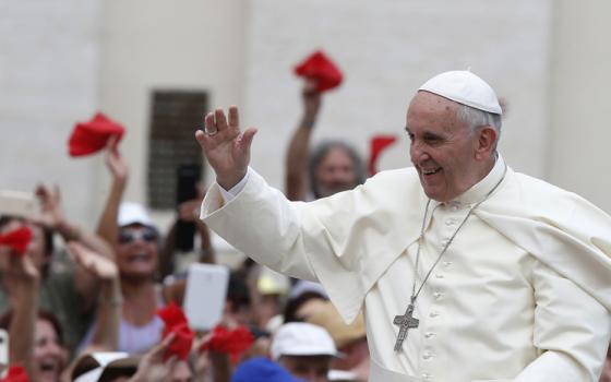 Pope Francis arrives to greet participants in the Renewal of the Spirit meeting in St. Peter's Square at the Vatican July 3. The meeting was with Catholics involved in the charismatic movement. (CNS photo/Paul Haring)