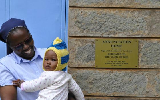 Sr. Margaret Wangeci holds a child belonging to one of the young mothers who has found shelter at the home. The sisters arrange to have the baby taken care of during the day while the mother attends school. (Lourine Oluoch)