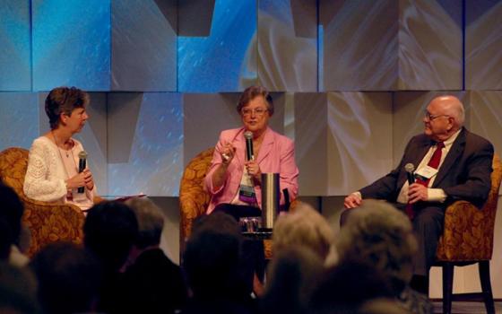 Immaculate Heart of Mary Sister Annmarie Sanders moderates a discussion between Congregation of Saint Joseph Sister Janet Mock and Society of the Divine Word Father Stephan Bevans Friday on how the Leadership Conference of Women Religious can move forward. (GSR photo/Dan Stockman)
