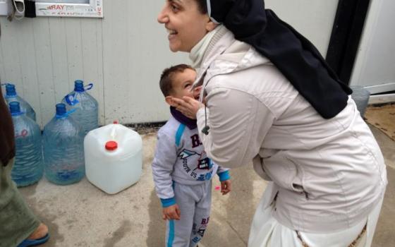 Dominican Sr. Ban hugs one of her students. (Courtesy of Dominican sisters)