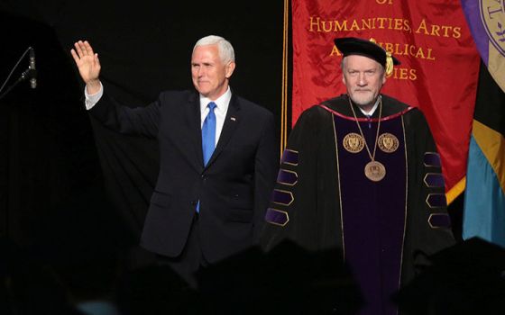 Vice President Mike Pence, left, attends the 2019 Taylor University commencement at the invitation of President Paul Lowell Haines, right. (RNS/Courtesy of Taylor University)