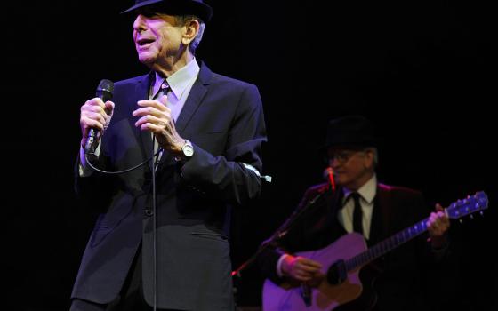 In this April 17, 2009, file photo, Leonard Cohen performs during the Coachella Valley Music & Arts Festival in Indio, Calif. (AP Photo/Chris Pizzello, File)