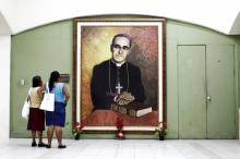 People look at a painting of slain Salvadoran Archbishop Óscar Romero at the cathedral in San Salvador in 2015. (CNS/Reuters/Jose Cabezas)