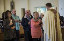 Parishioners receive Communion during Mass at St. John Catholic Church in Westminster, Maryland, in May 2017. (CNS/Chaz Muth)