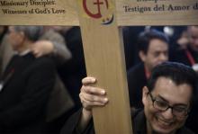 A delegate carries holds the encuentro cross Sept. 20 prior to the start of the Fifth National Encuentro, or V Encuentro, in Grapevine, Texas. (CNS/Tyler Orsburn)