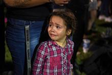 Serenity Lara cries during an Aug, 4, 2019, vigil, a day after a mass shooting at a Walmart store in El Paso, Texas. Pope Francis joined Catholic Church leaders expressing sorrow after back-to-back mass shootings in the United States left at least 31 dead