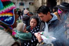 A family carries figurines of the Christ Child outside St. Francis Church during celebrations for the feast of the Epiphany, Jan. 6, 2019, in La Paz, Bolivia. (CNS/Reuters/David Mercado)