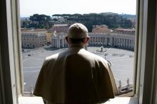 Pope Francis looks over an empty St. Peter's Square after leading a livestream of the recitation of the Angelus from the library of the Apostolic Palace March 22. (CNS/Vatican Media)