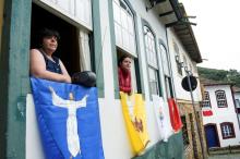 Residents listen to Easter Mass through a local radio station in Ouro Preto, Brazil, April 12, during the COVID-19 pandemic. (CNS/Reuters/Washington Alves)