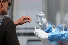 A homeless man in Los Angeles is tested for the coronavirus disease at a fire department testing station April 21. (CNS/Reuters/Lucy Nicholson)