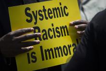 A protester is seen near the Capitol in Washington May 21, 2018, during an anti-racism demonstration. In remarks Nov. 16, during the U.S. bishops' virtual fall meeting, Deborah Amato, National Advisory Council chair, urged the bishops to continue to look 