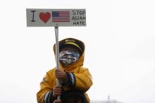 A child in Bellevue, Washington, holds a sign during a "Stop Asian Hate" rally and vigil March 20, following the deadly shootings March 16 at three Asian day spas in metro Atlanta. (CNS/Reuters/Lindsey Wasson)