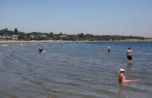 People look for ways to cool off at Willow's Beach during record-breaking temperatures in Victoria, British Columbia, June 28, 2021. (CNS photo/Chad Hipolito, Reuters)