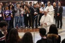 Pope Francis prepares to address young people who participated in a pilgrimage hike from the Monte Mario nature reserve in Rome to St. Peter's Basilica at the Vatican Oct. 25, 2018, during the Synod of Bishops on young people, the faith and vocational discernment. Catholic young people are among the many groups of the faithful worldwide invited to share testimony and talk abut their experience of church during preparations for the 2023 world Synod of Bishops on synodality. (CNS photo/Paul Haring)