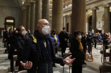 People pray during an evening prayer service hosted by the Community of Sant'Egidio at the Basilica of Santa Maria in Trastevere in Rome Feb. 24, 2022. (CNS photo/Paul Haring)