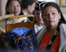 An Indigenous woman displays a cradleboard as Pope Francis meets with a delegation of Indigenous peoples in the archbishop's residence in Quebec City July 29, 2022. (CNS photo/Paul Haring)