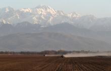 Agricultural workers operate tractors in a field in the Almaty region of Kazakhstan April 6. Pope Francis is scheduled to visit Kazakhstan Sept. 13-15 to attend the Congress of World and Traditional Religions. (CNS photo/Reuters/Pavel Mikheyev)