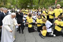 Pope Francis greets about 100 children and young people who gathered outside the Church of St. Laszlo in Budapest, Hungary, to pray for Pope Francis April 29, 2023. (CNS photo/Vatican Media)