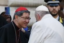 Pope Francis talks with Cardinal Luis Antonio Tagle after praying in front of a Marian statue at the Spanish Steps in Rome Dec. 8, 2022, the feast of the Immaculate Conception. (CNS/Paul Haring) 