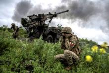 Ukrainian service members with the 55th Separate Artillery Brigade fire a Caesar self-propelled howitzer toward Russian troops near the town of Avdiivka in Ukraine's Donetsk region May 31, 2023, amid Russia's ongoing attack on the country. 