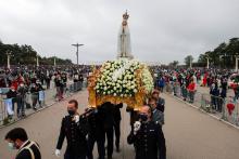 The statue of Our Lady of Fatima is carried May 13, 2021, at the Marian shrine of Fatima in central Portugal.