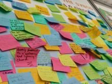 Dozens of Post-it Notes with prayers and requests from young people are seen on the wall at the Synod of Bishops' booth in a park in Lisbon, Portugal, during World Youth Day Aug. 1-6. (OSV News/Courtesy of the Synod Secretariat)