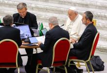 Pope Francis joins leaders of the assembly of the Synod of Bishops for a working session Oct. 23 in the Vatican's Paul VI Audience Hall. (CNS/Lola Gomez)