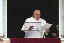 Pope Francis reads his message during the Angelus noon prayer from the window of his studio overlooking St. Peter's Square, at the Vatican, Sunday, March 10, 2024. 