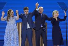 Democratic vice presidential nominee Minnesota Gov. Tim Walz, second from right, poses with his wife Gwen Walz, from right, son Gus Walz and daughter Hope Walz after speaking during the Democratic National Convention, Aug. 21 in Chicago. (AP photo/J. Scott Applewhite)