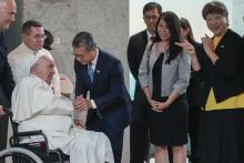 From left, Pope Francis is welcomed by Singapore's Minister of Culture, Community and Youth Edwin Tong and his wife (name not given) and the Ambassador of Singapore to the Holy See Ang Janet Guat Har as he arrives at Singapore Changi International Airport, Wednesday, Sept. 11, 2024. Pope Francis is heading to Singapore for the final leg of his 11-day trip to Asia and Oceania. (AP Photo/Gregorio Borgia)