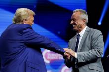 Robert F. Kennedy Jr. and then Republican presidential candidate Donald Trump greet each other at a campaign event in Duluth, Ga., Oct. 23. 