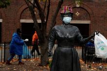 People near a statue of Ella Fitzgerald in Yonkers, New York, Nov. 17 (CNS/Reuters/Shannon Stapleton)