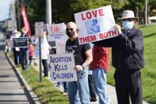 Pro-life advocates mark Respect Life Sunday by participating in the 23rd annual “Stand Up for Life” roadside vigil Oct. 4 in Manorville, New York. (CNS/Gregory A. Shemitz)