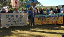 A multi-faith delegation prays before a march and rally opposing the Enbridge Line 3 pipeline near the Mississippi headwaters in northern Minnesota in early June. (Marianne Comfort)