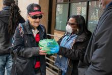 Volunteers hand out meals to homeless people in the community at St. Anthony's in San Francisco's Tenderloin district. (Provided photo)