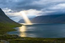 Beam of sunlight on water (Unsplash/Davide Cantelli)