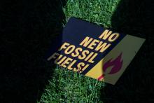 A sign protesting fossil fuels is seen on the lawn outside of the U.S. Capitol during a protest in Washington Oct. 18, 2019. (CNS/Reuters/Sarah Silbiger)