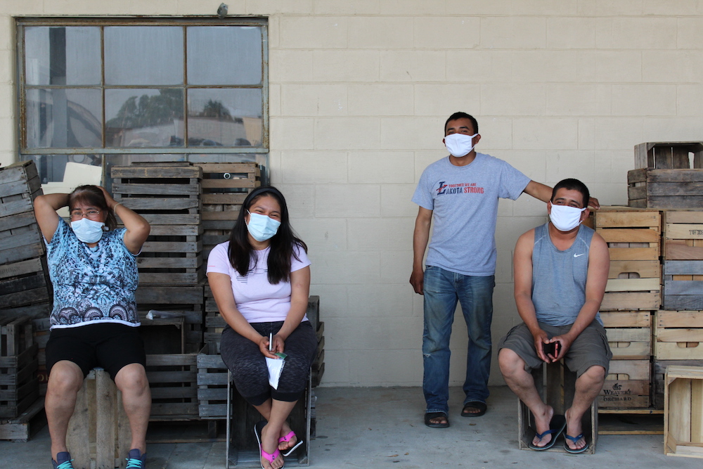 Workers wait for testing and health evaluations at Eshleman Farm in Clyde, Ohio (Kate Oatis)