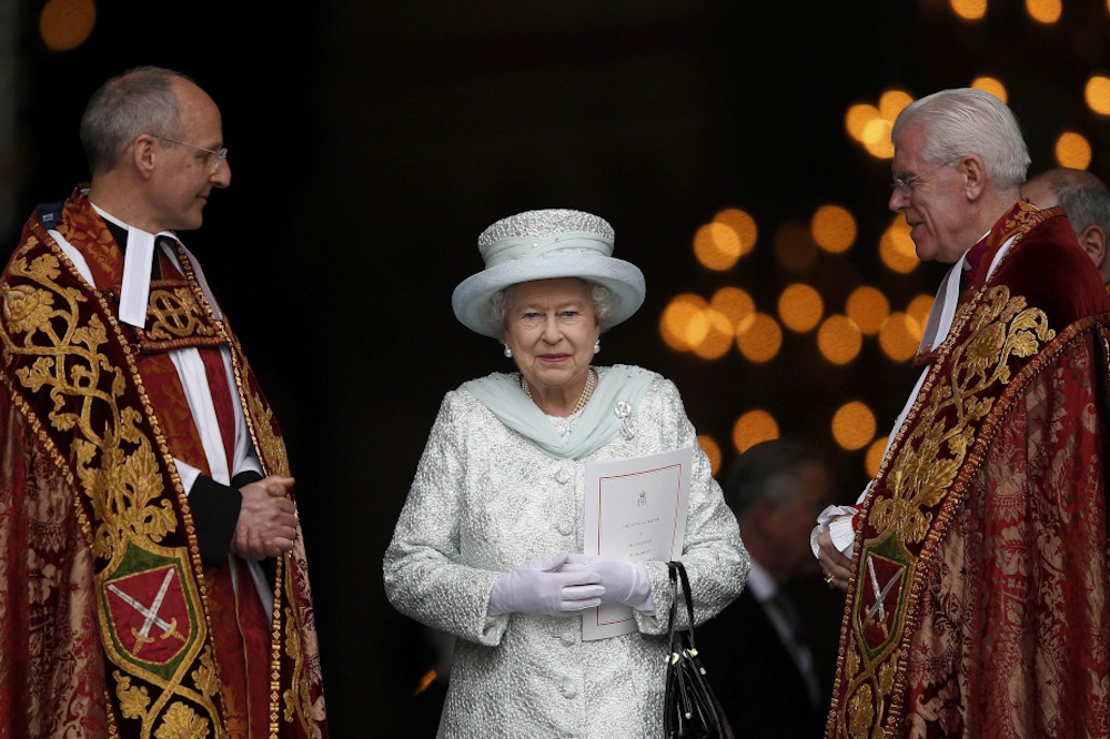 Britain's Queen Elizabeth II smiles as she leaves St. Paul's Cathedral with the Revs. David Ison and Michael Colclough following a thanksgiving service to mark her diamond jubilee in London June 5, 2012. (CNS/Reuters/Andrew Winning)