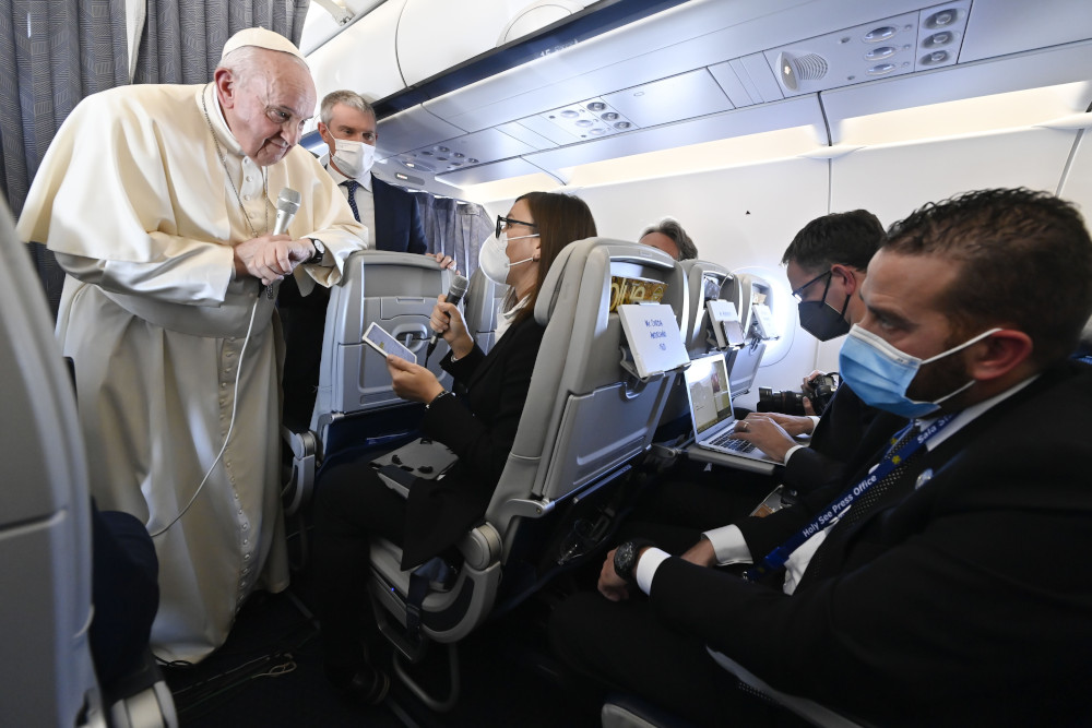 Pope Francis answers questions from journalists aboard his flight from Athens, Greece, to Rome Dec. 6, 2021. (CNS/Vatican Media)