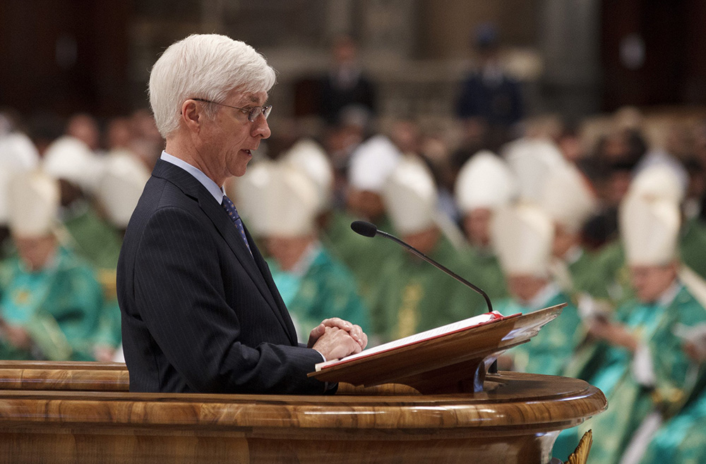 Ralph Martin, a professor at Sacred Heart Seminary in Detroit, reads the first reading as Pope Benedict XVI celebrates the closing Mass of the Synod of Bishops on the new evangelization in St. Peter's Basilica at the Vatican Oct. 28, 2012. (CNS/Paul Haring)