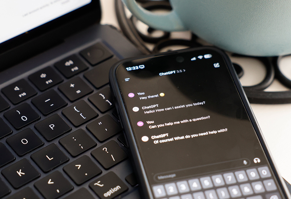 The ChatGPT app is seen on a phone placed atop a keyboard in this photo taken in Rome March 8, 2024. (CNS/Lola Gomez)