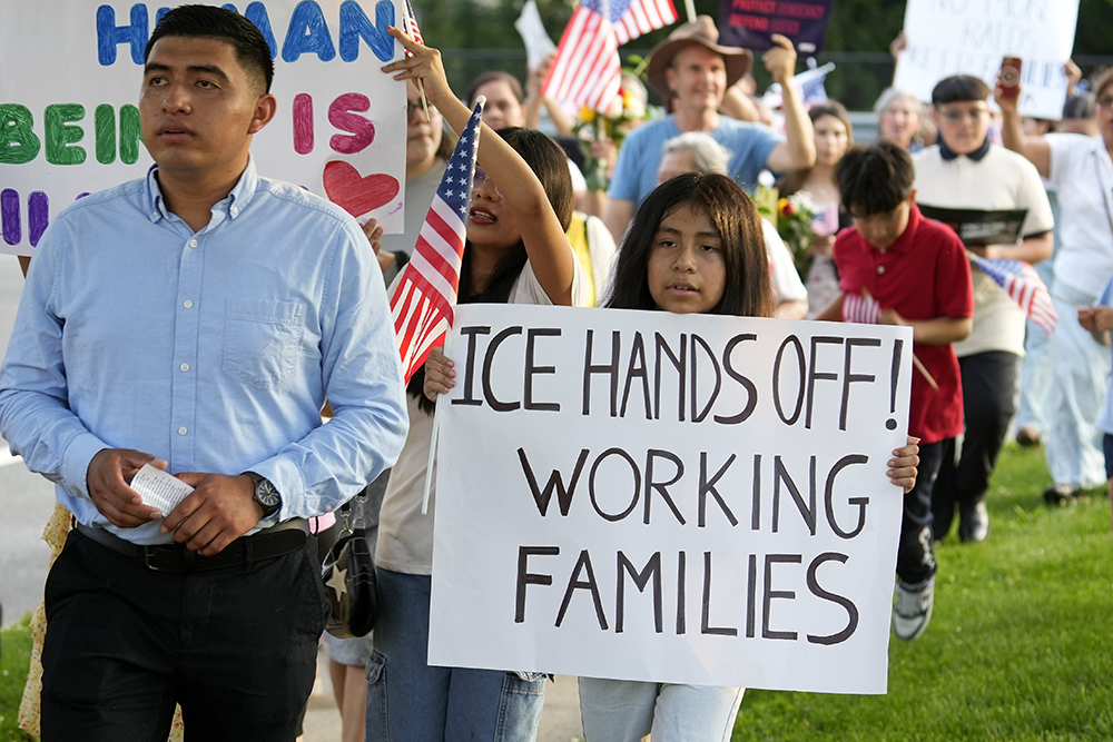 People attend a pro-immigrant march and rally following a Spanish-language Mass at St. John the Evangelist Church in Riverhead, N.Y., June 22, 2025, the feast of the Body and Blood of Christ. (OSV News/Gregory A. Shemitz)