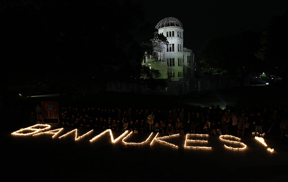 A file photo shows a "BAN NUKES!" slogan which was made of candle lights in front of the gutted Atomic Bomb Dome in Hiroshima, western Japan. (OSV News/Reuters/Kim Kyung-Hoon)
