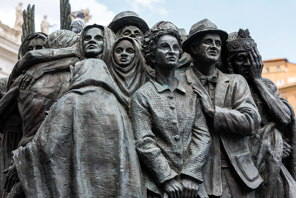 A detail is seen of "Angels Unawares," a sculpture by Canadian Timothy Schmalz in St. Peter's Square at the Vatican, June 3, 2024. The sculpture depicts a boat with 140 figures of migrants from various historical periods and various nations. (CNS/Lola Gomez)