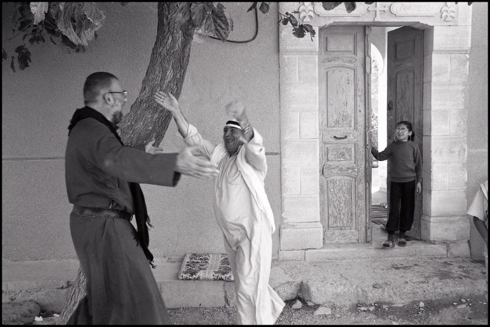  Jesuit Fr. Paolo Dall'Oglio greets a Syrian neighbor.