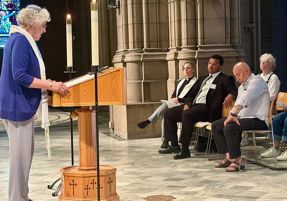 Rabbi Enid Lader of Beth Israel-the West Temple addresses the Cleveland interfaith prayer in solidarity with migrants on June 24. (Christine Schenk)