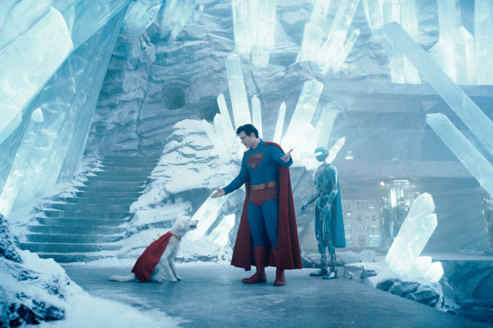 Superman and Krypto the Superdog facing each other in a room full of crystals.